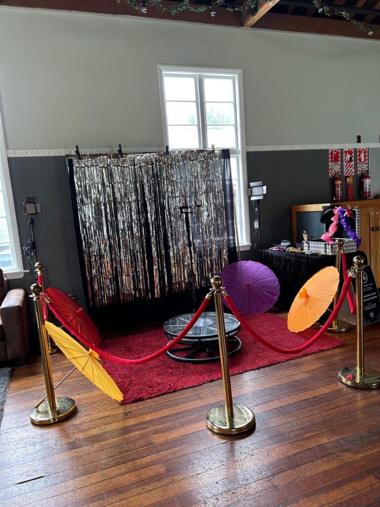 professional 360 video booth hire setup with platform lighting and event props in Wellington New Zealand