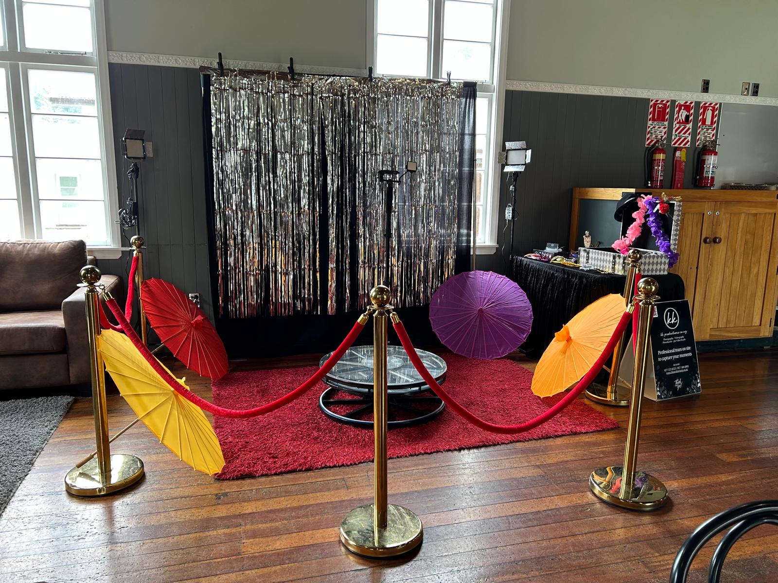 360 video booth setup at event venue in Wellington with backdrop lighting and props ready for guests