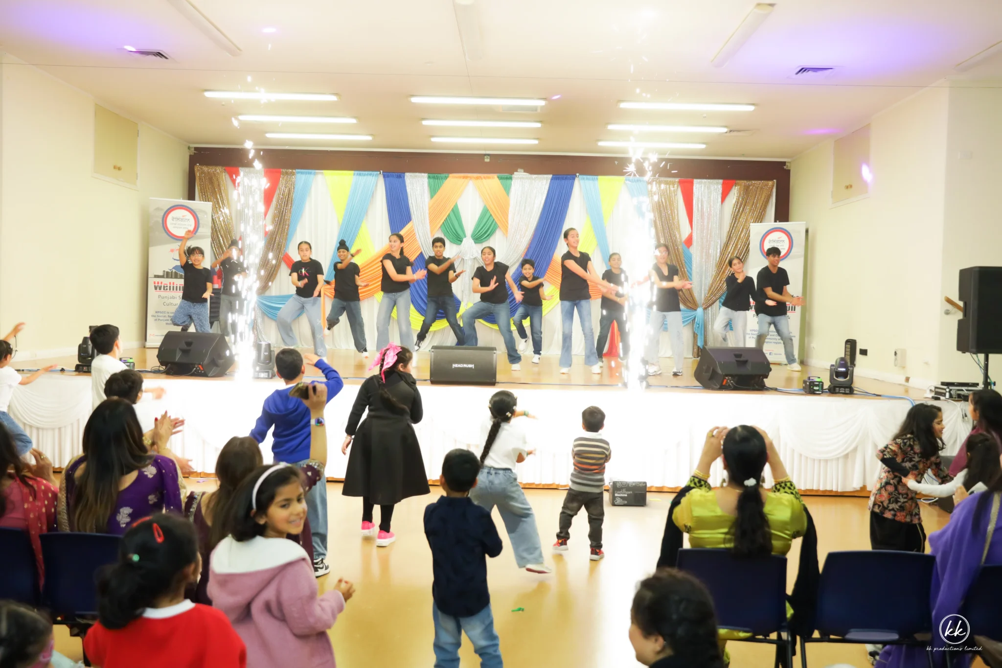 Audience and children participating in community activities at a cultural event in Wellington NZ.